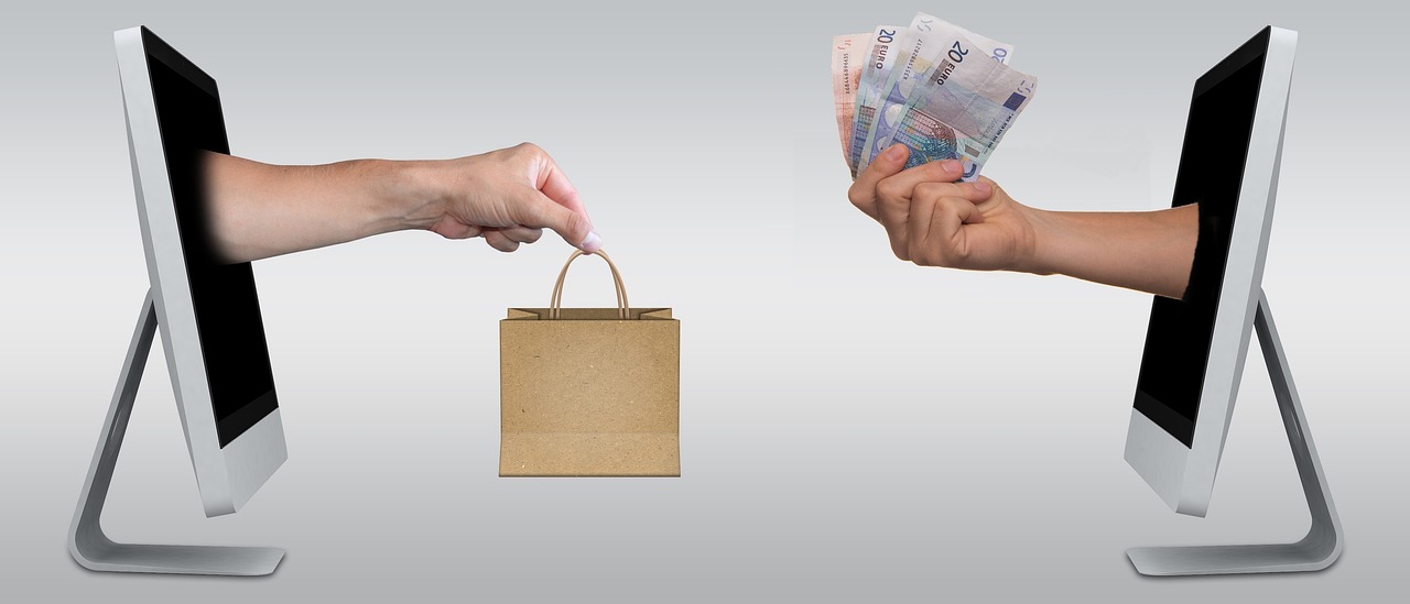 A person exchanging money for a gift bag, depicting an eCommerce transaction
